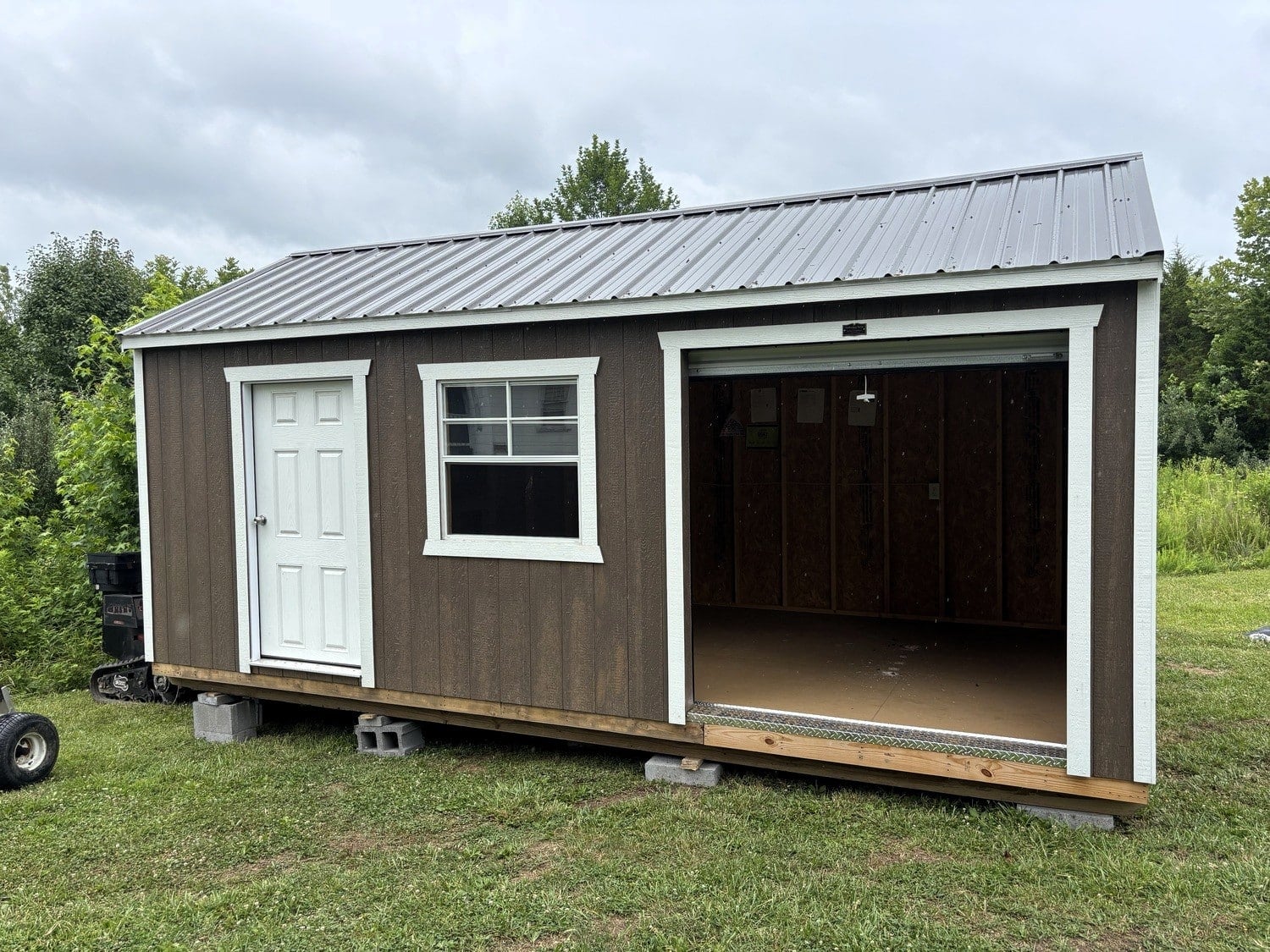 A Timberline Barns workshop set on concrete blocks